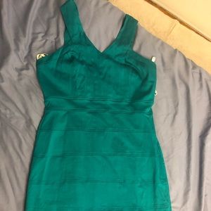 Green jewel tone body con dress